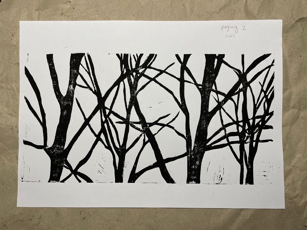 Photo of a linocut print of tress, with some background noise.