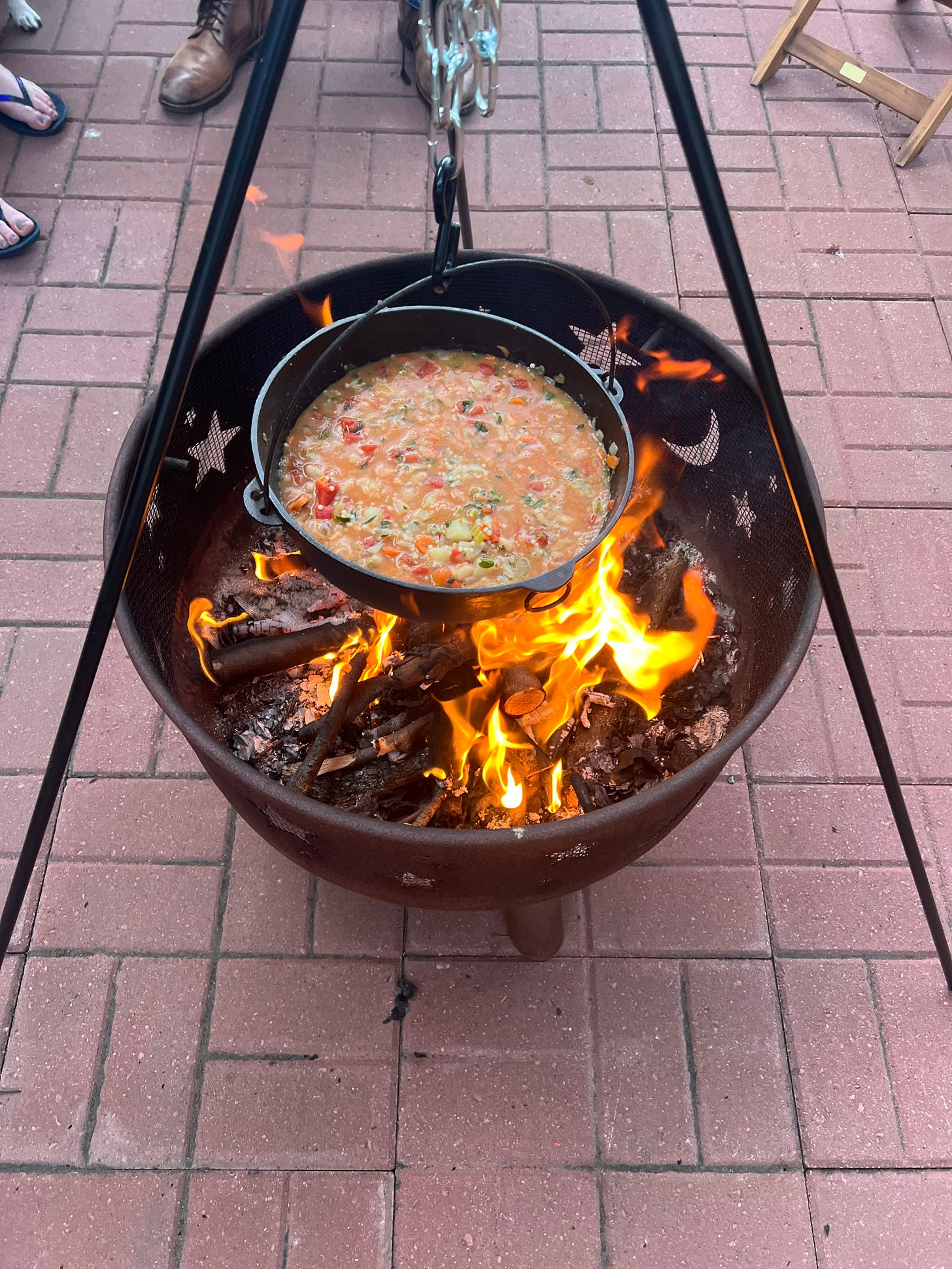 Soup cooking outdoors in a kettle