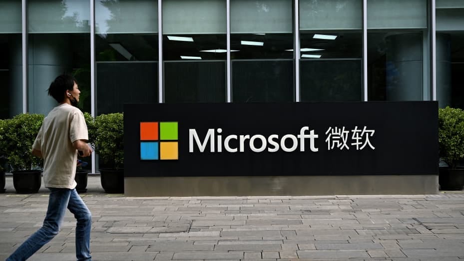 A man walks past Microsoft's local headquarters in Beijing on July 20, 2021, the day after the US accused Beijing of carrying out the cyber attack on Microsoft and charged four Chinese nationals over the "malicious" hack in March. (Photo by Noel Celis / AFP) (Photo by NOEL CELIS/AFP via Getty Images)