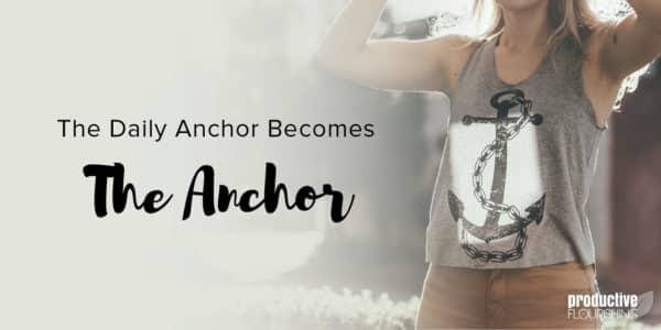 The torso of a woman with her arms up, wearing a grey tank-top with an anchor on it. Text Overlay: The Daily Anchor Becomes The Anchor.