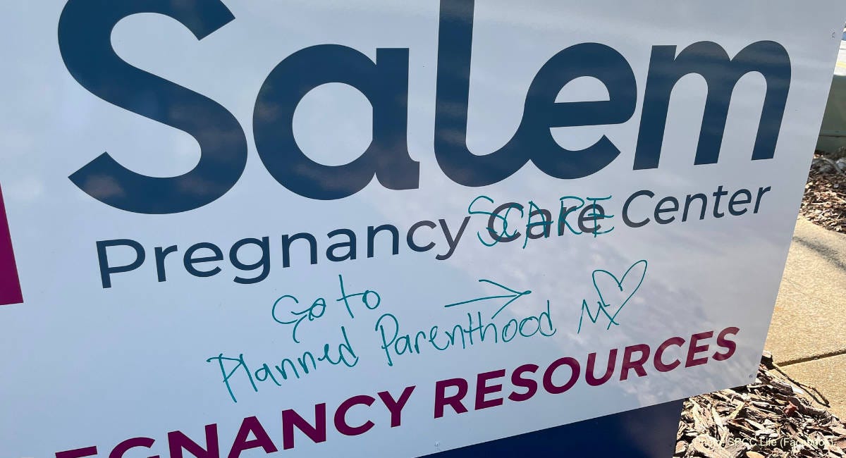 vandalized Winston-Salem pregnancy center sign, with "Go to Planned Parenthood" written on it vandalized Winston-Salem pregnancy center sign, with "Go to Planned Parenthood" written on it