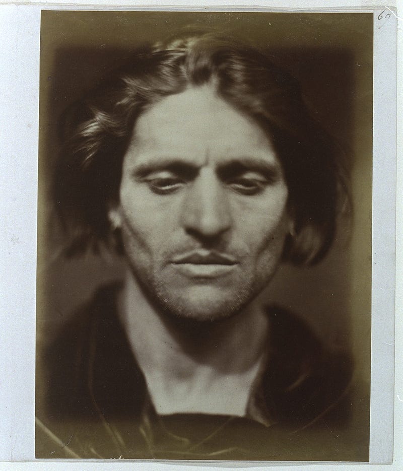 Iago, study from an Italian. Julia Margaret Cameron captures model Angelo Colarossi looking down in deep, brooding concentration, imitating the Shakespearean villain of Othello.