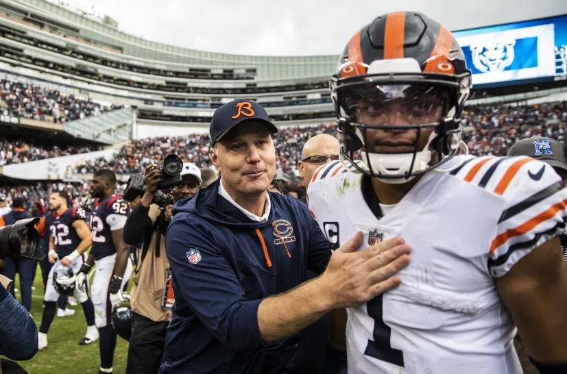 Chicago Bears head coach Mattt Eberflus stands next to Chicago Bears quarterback Justin Fields, in Chicago's 2022 victory over the Houston Texans.
