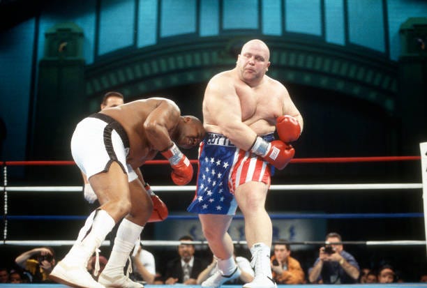 Butterbean fights Doug Phillips during a heavy weight boxing match on December 6, 1997 at the Convention Center in Atlantic City, New Jersey.