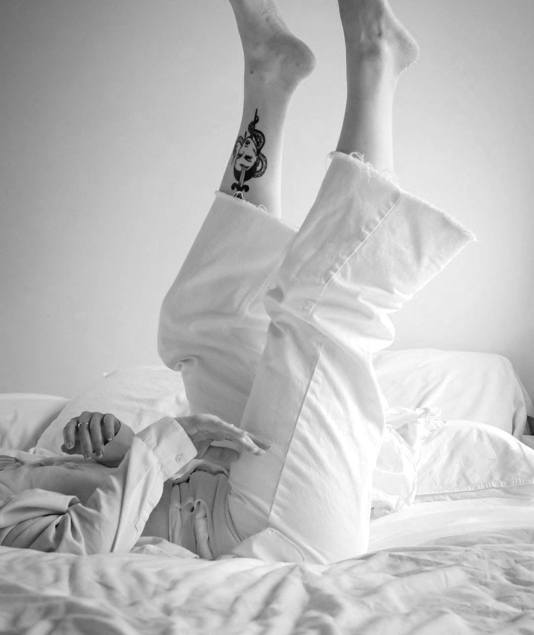 person with black and red tattoo on right leg