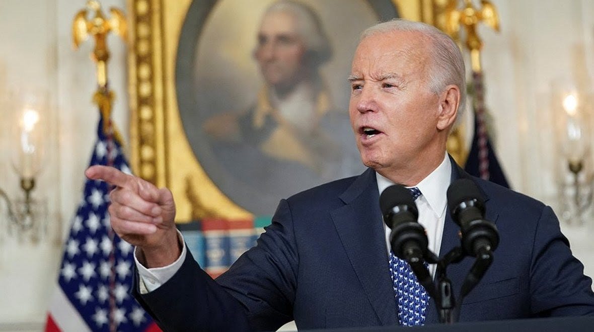 Joe Biden points his finger during a press briefing at the White House