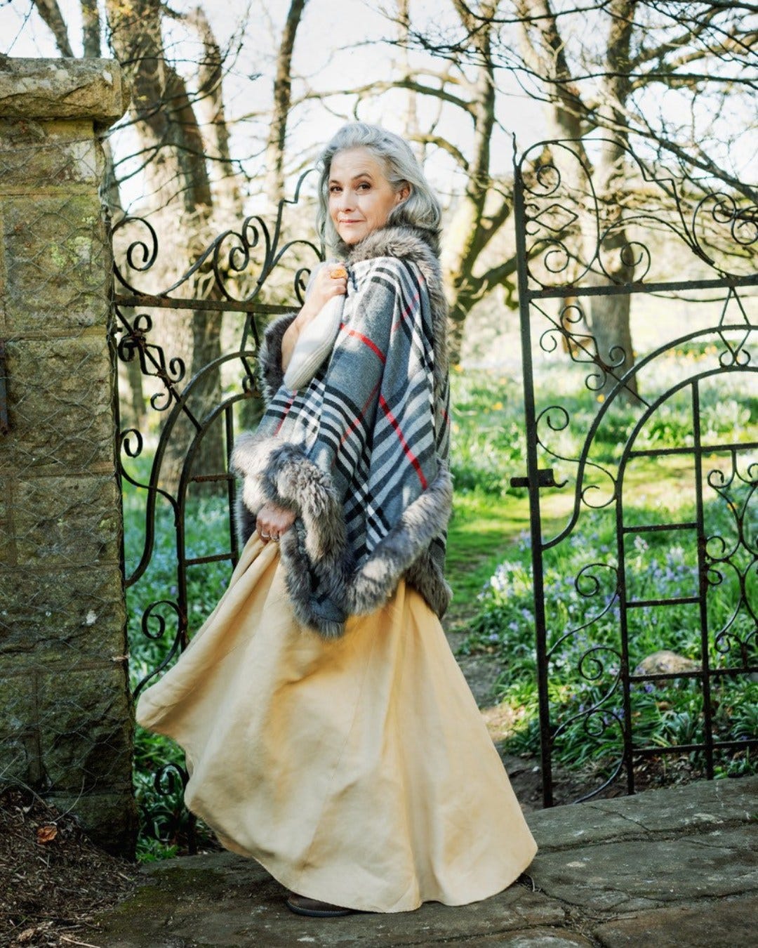 May be an image of 1 person, fur coat and scarf