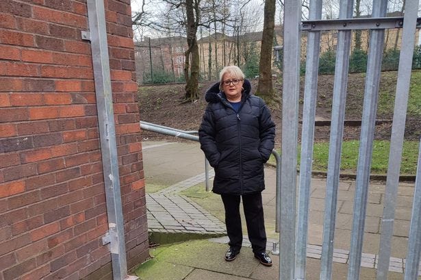 Councillor Elaine McDougall at fence where gate was ripped off.