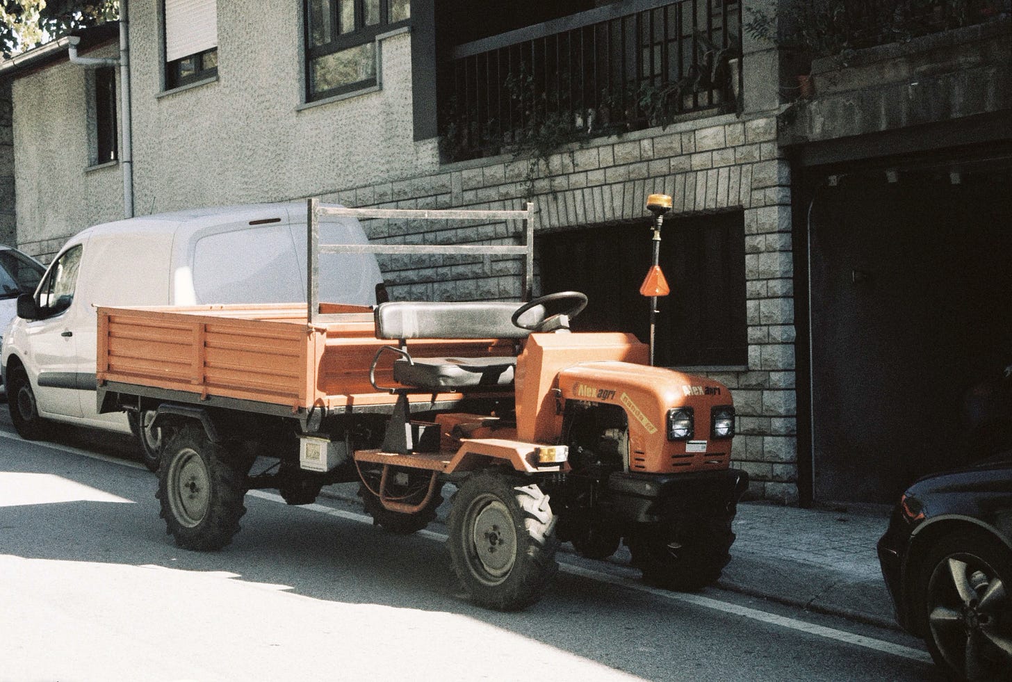 A small red truck used to transport the grapes.
