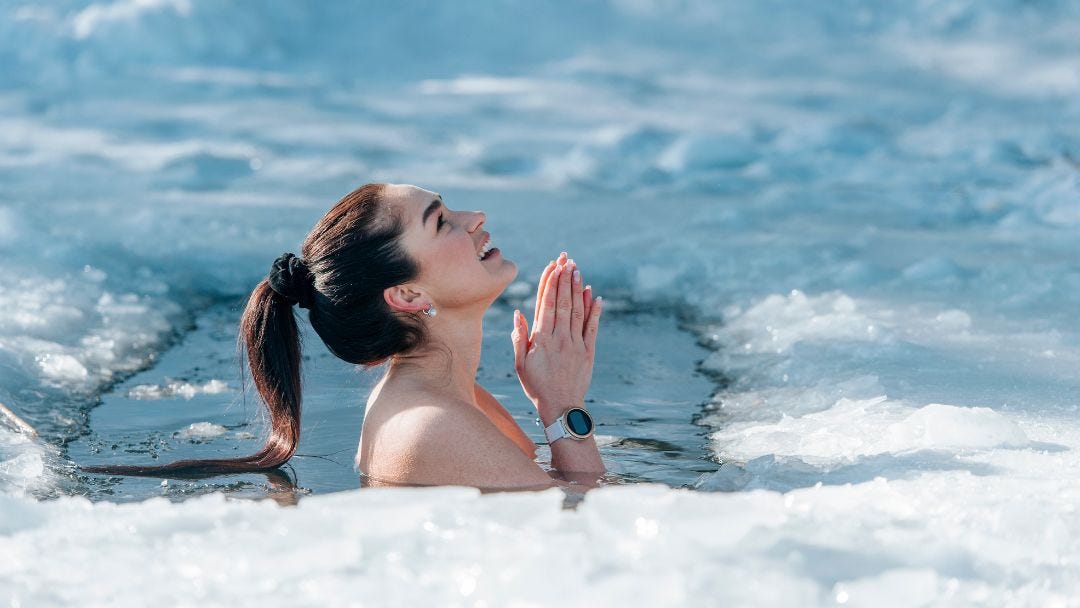 Training character through resilience—woman in an ice bath for mental and physical growth.