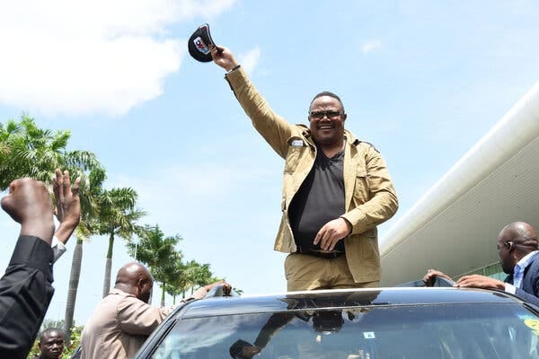 Tundu Lissu, an opposition leader, greeting supporters at the airport in Dar es Salaam, Tanzania, on Wednesday. He had said he was “hopeful to be going back home.”
