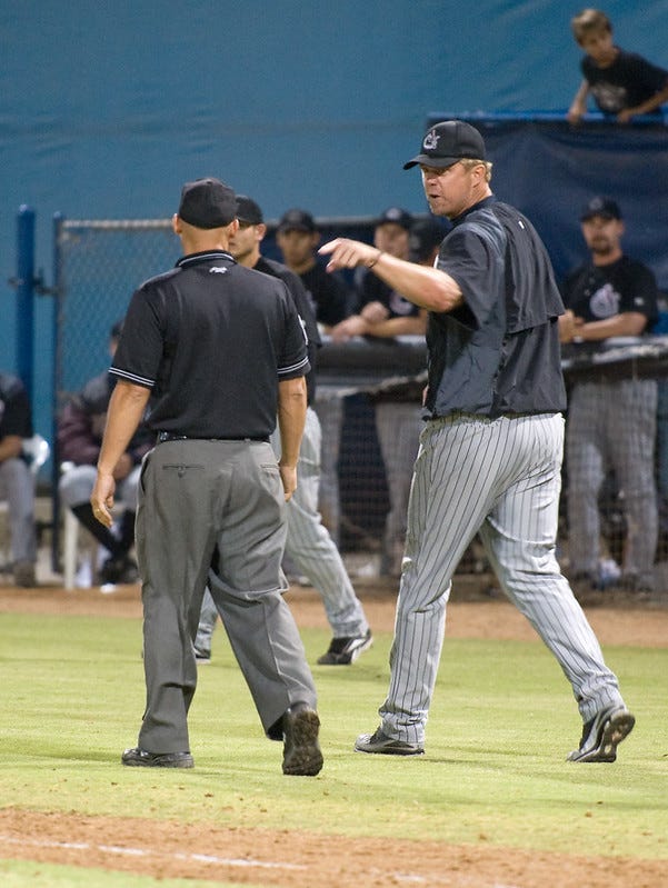 Manager complains to a different umpire while leaving the field