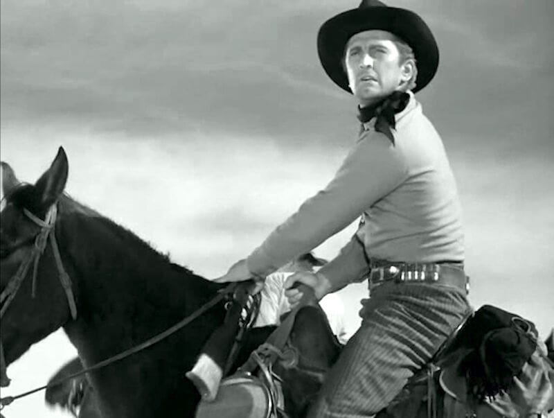 Kirk Douglas em cima de um cavalo em No existen treinta y seis maneras de mostrar cómo un hombre se sube a un caballo, de Nicolás Zukerfield