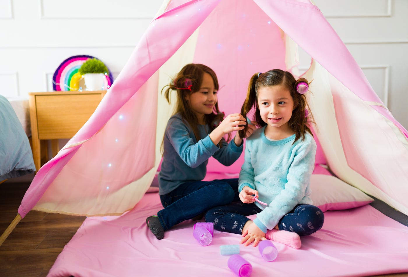 two girls playing in a tent