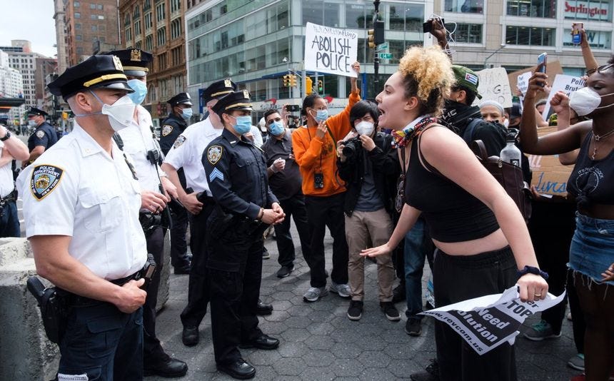People yell at police officers during a protest in response to the death of George Floyd, an African-American man who died while in the custody of the Minneapolis police, in New York, New York, USA, 28 May 2020. EPA/JUSTIN LANE