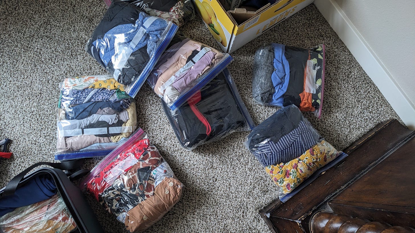 sealing up bags of clothing to pack