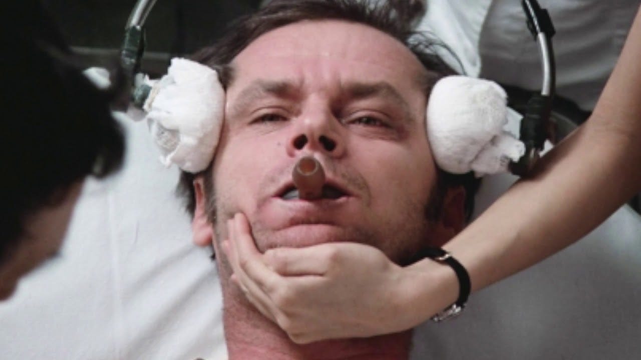 McMurphy with electrodes on his temple before receiving electroshock therapy.