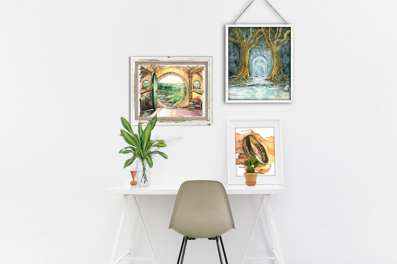 May include: Three framed watercolor paintings on a white wall. The first painting is a yellow and green watercolor of a doorway leading to a green landscape. The second painting is a blue and green watercolor of a path leading to a light blue archway through a forest. The third painting is a brown and green watercolor of a gold ring.