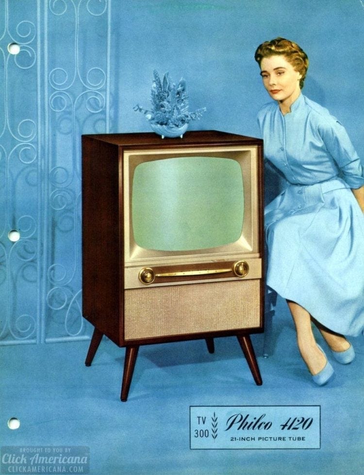 Depressed woman dressed in blue with vintage television.