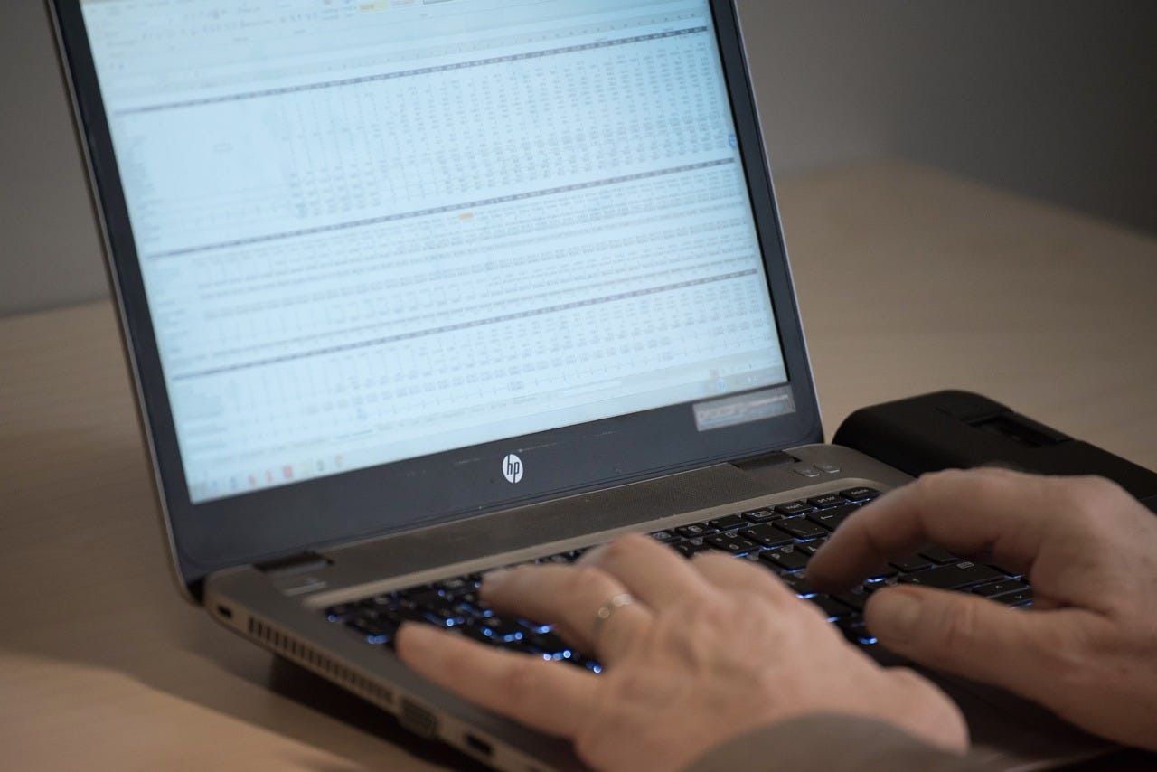 Person working at data on a computer