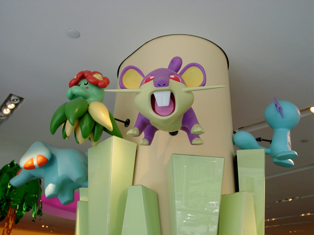 More life-sized Pokémon statues, located on the ground floor. In this photograph, we can see Phanpy, Wooper, Bellossom, and Rattata attached to a pillar