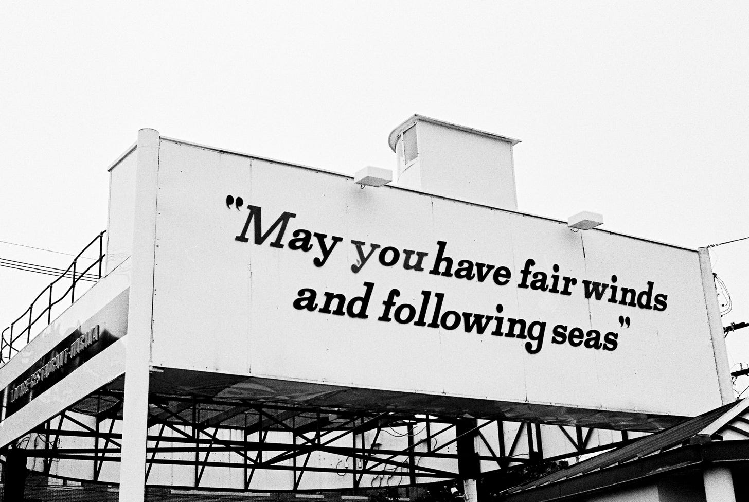 Billboard that says "May you have fair winds and following seas"