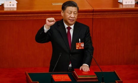 Chinese President Xi Jinping takes his oath during the Third Plenary Session of the National People's Congress (NPC) at the Great Hall of the People, in Beijing