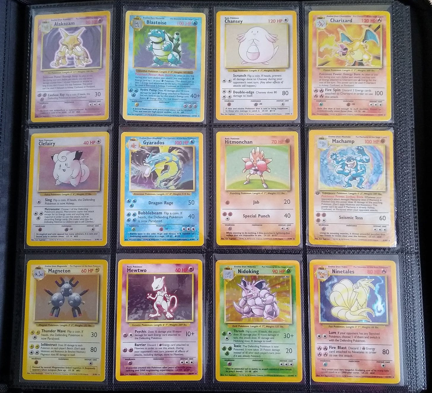 Pokémon cards from the Base set, featuring the first twelve holographic cards from my personal collection