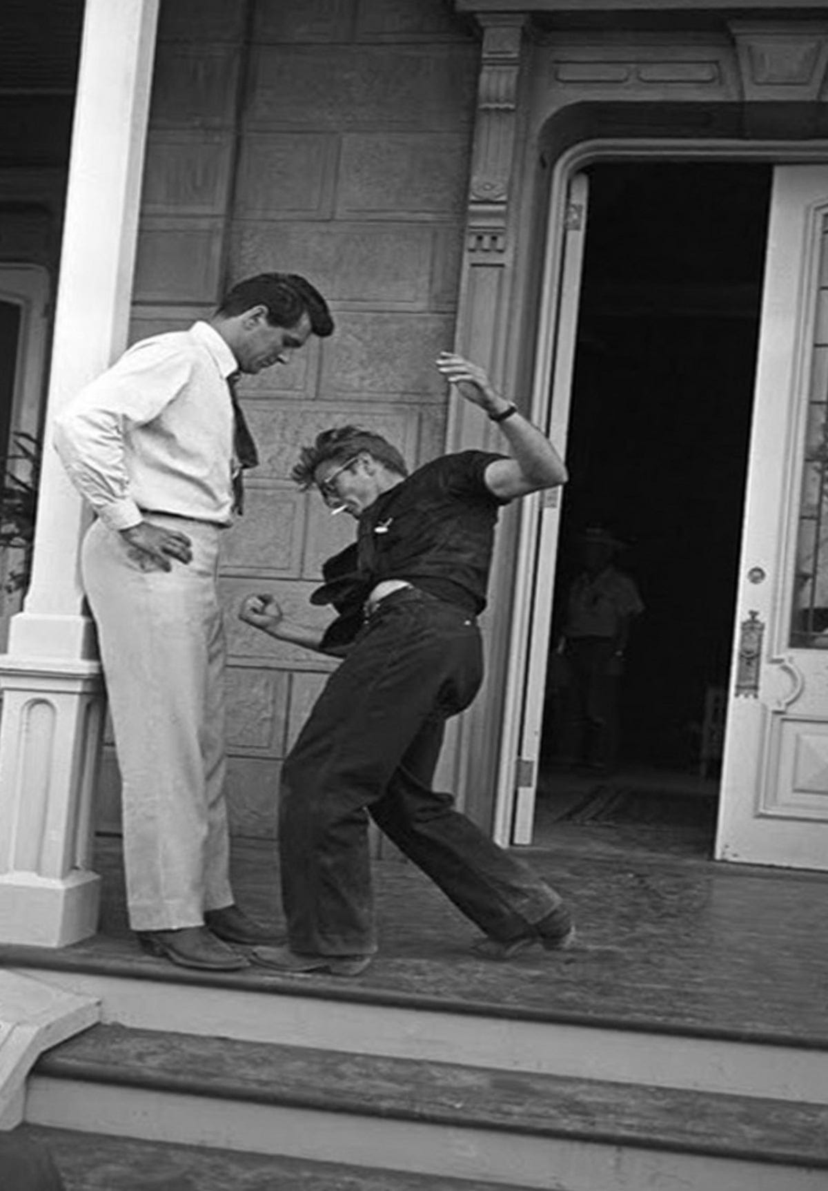 James Dean pretends to punch Rock Hudson on the set of “Giant.”