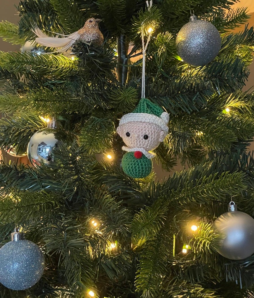 Photo of a crocheted christmas elf tree ornament