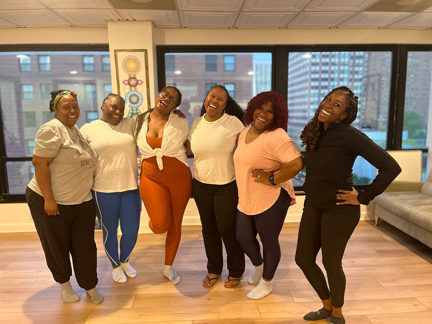 Picture of Black women smiling in a yoga studio
