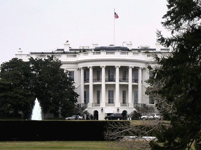 Front of White House building and lawn.