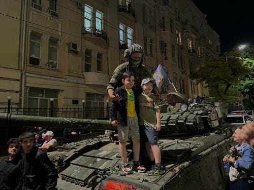 Children pose with Wagner PMC tanker in Rostov-on-Don