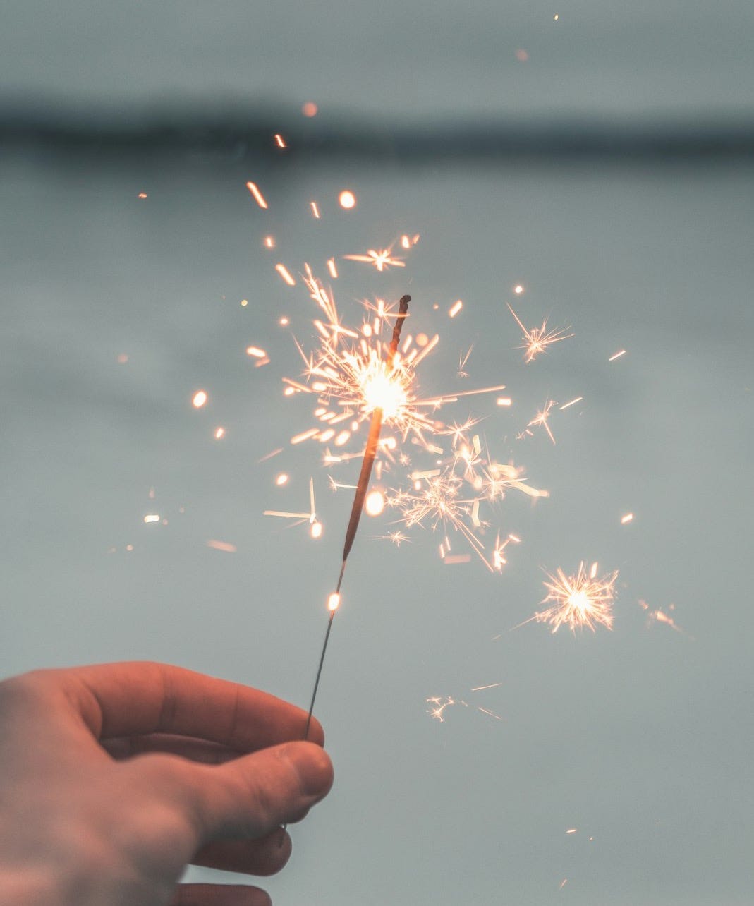 person holding sparkler