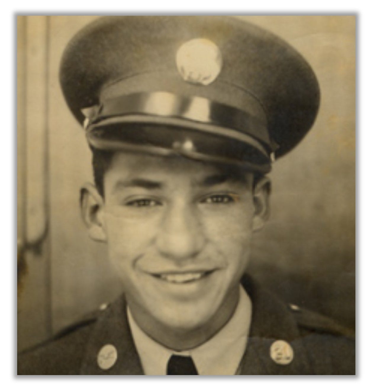 Headshot of Pena, in uniform.  He is smiling and looks young.