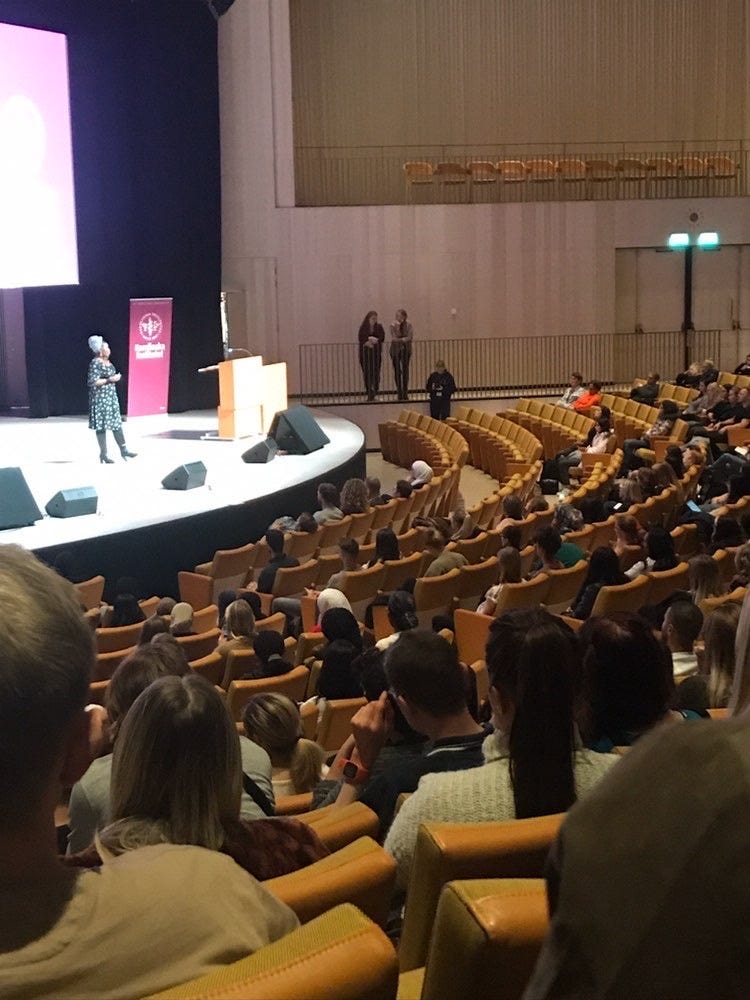 Lovette Jallow speaking at Karolinska Institutet to an audience of healthcare professionals, including doctors, therapists, and nurses. The lecture focuses on neurodivergent inclusion, structural bias in care systems, and anti-racist clinical practice. Lovette Jallow speaking at Karolinska Institutet to an audience of healthcare professionals, including doctors, therapists, and nurses. The lecture focuses on neurodivergent inclusion, structural bias in care systems, and anti-racist clinical practice.