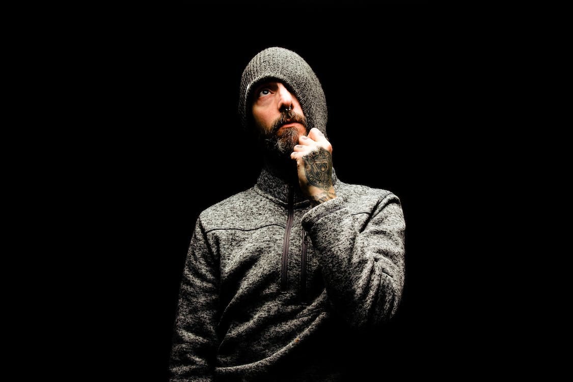 Free Man In Gray Knit Cap And Gray Sweater Stock Photo
