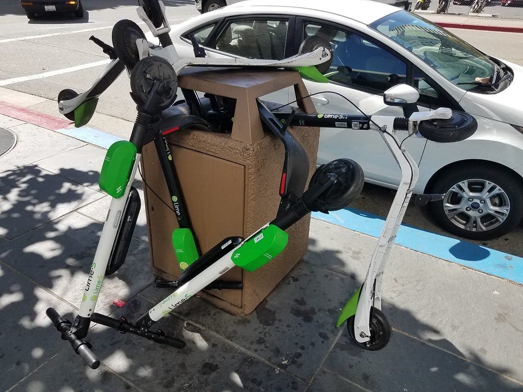 Scooters in trash in downtown Oakland | Several Lime electri… | Flickr