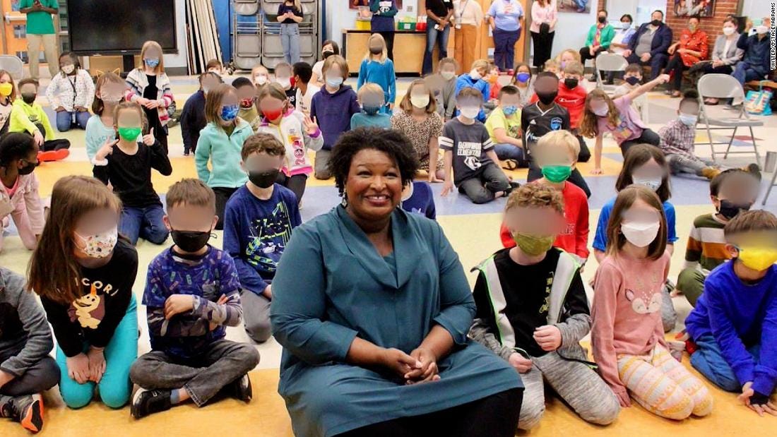 Stacey Abrams comes under fire for not wearing a mask in now-deleted photos  with masked schoolchildren | CNN Politics