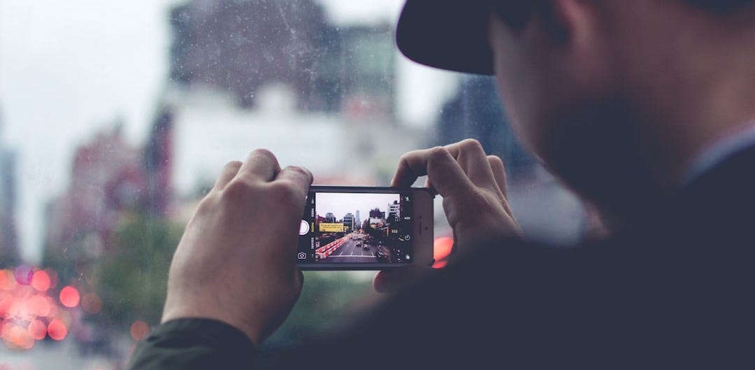 man using the smartphone camera