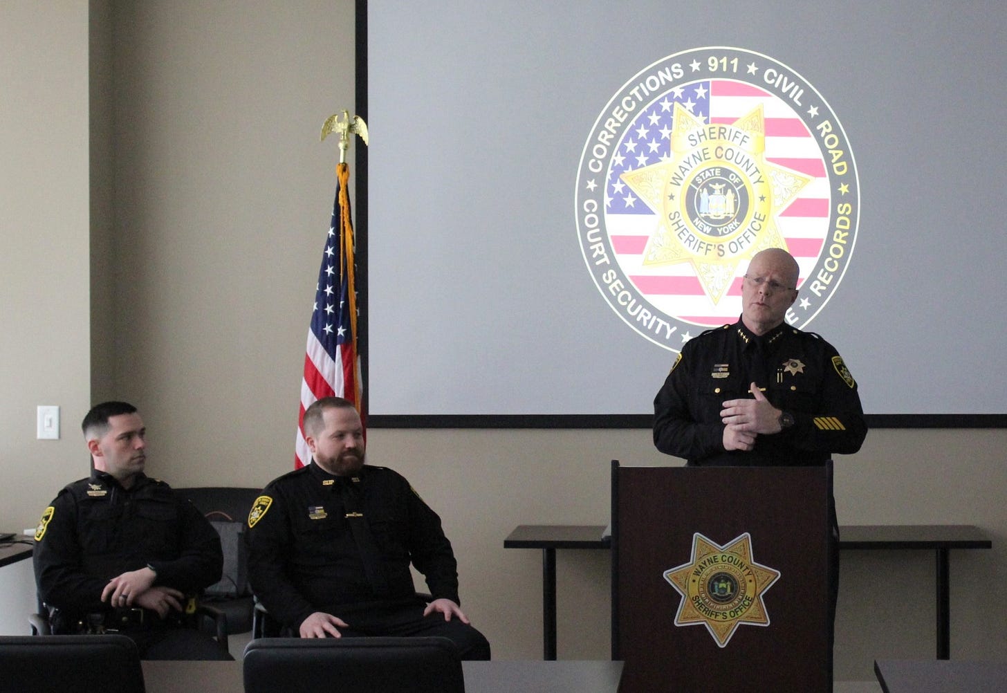 May be an image of ‎4 people and ‎text that says '‎CORRECTIONS ) * 911 * CIVIL * SHERIFF WAYNE STAT STATE STAI COUNTY ROAD ￥ * כסחצב SHERIFF' ት OFFICE E 32 עדכסעם SECURITY * 前‎'‎‎
