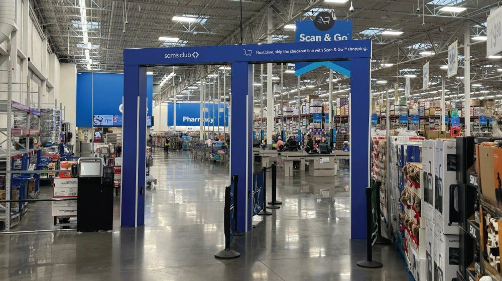 Inside of Sam's Club shows the AI and video application technology at its exit.