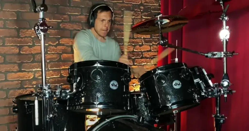 Graham Stephan as drummer in music band