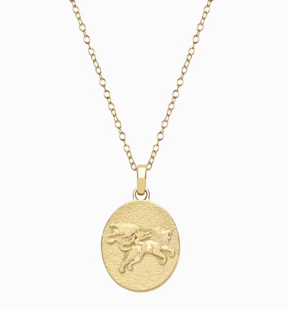 Summer Zodiac Sign Gift Guide: A gold filigree necklace with a raised lion motif, but Awe-Inspired