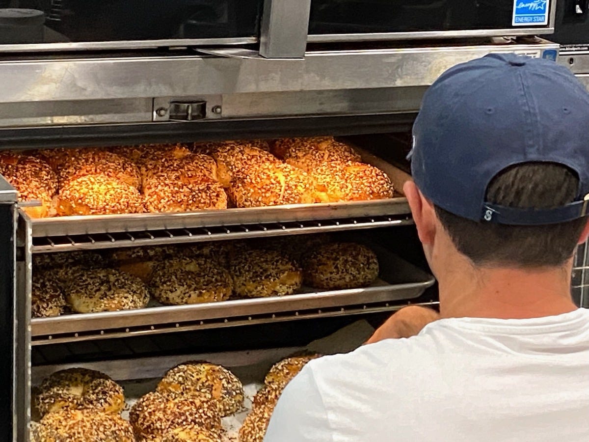 Aaron Emas watching bagels bake.