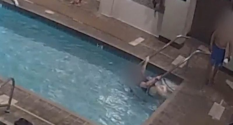 Disturbing moment woman drowns in shallow end of Las Vegas pool while clutching handrail... as swimmers walk past her