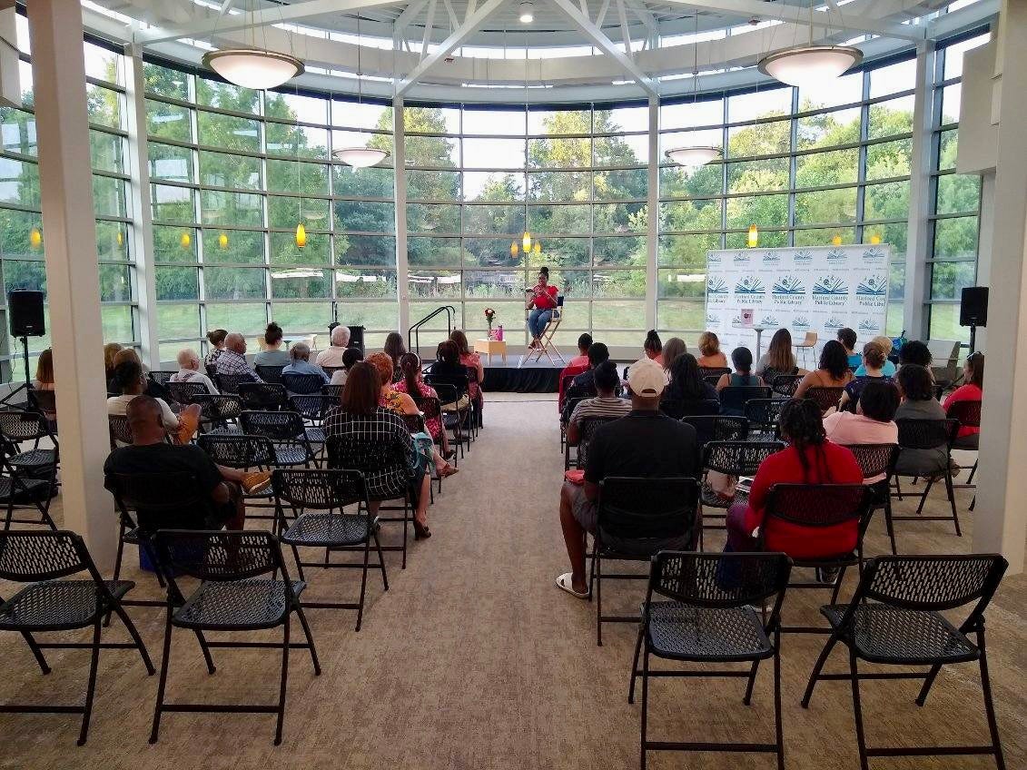 Picture of people attending an author reading/event at a library