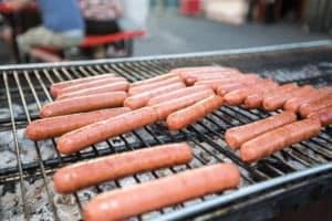 hot dogs on the grill