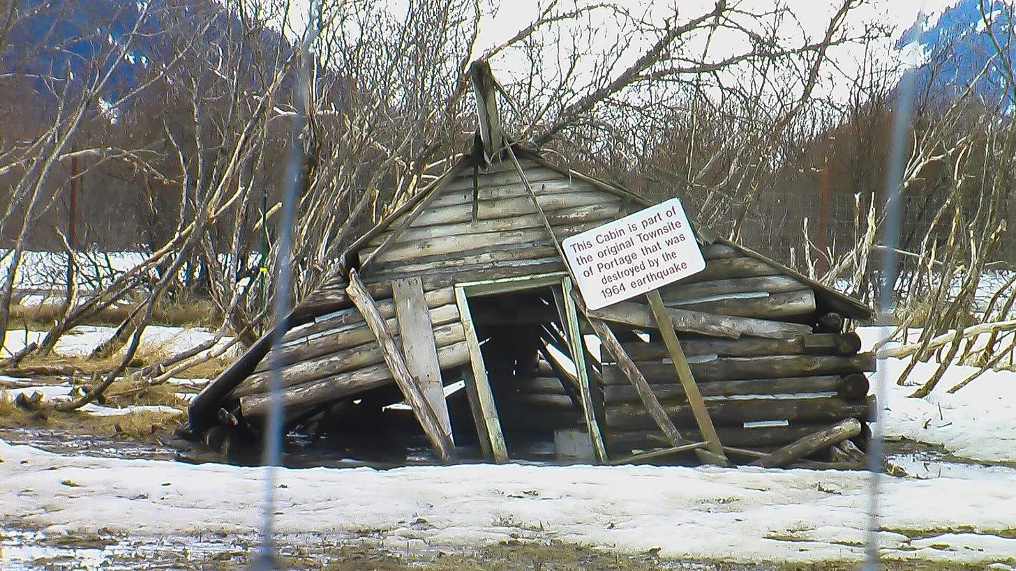 What is left of an old cabin from the town of Portage, Alaska.