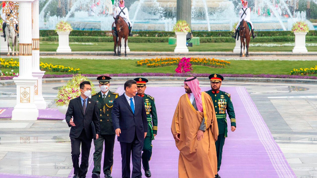 In this photo made available by Saudi Press Agency, SPA, Chinese President Xi Jinping, left, is greeted by Saudi Crown Prince and Prime Minister Mohammed bin Salman, after his arrival at Al Yamama Palace, in Riyadh, Saudi Arabia, Thursday, Dec. 8, 2022. (Saudi Press Agency via AP)